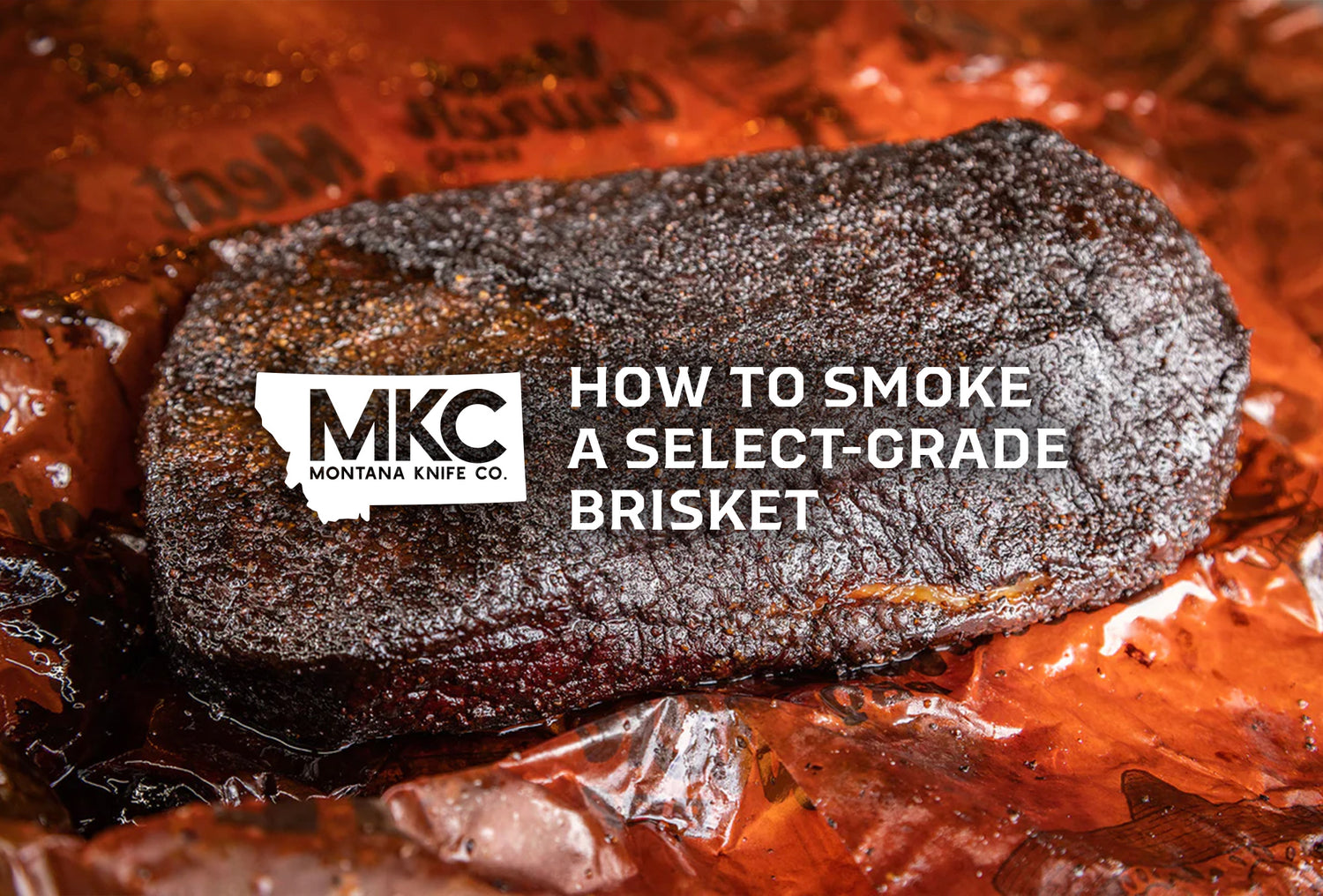 A smoked brisket resting on reddish-brown butcher paper.