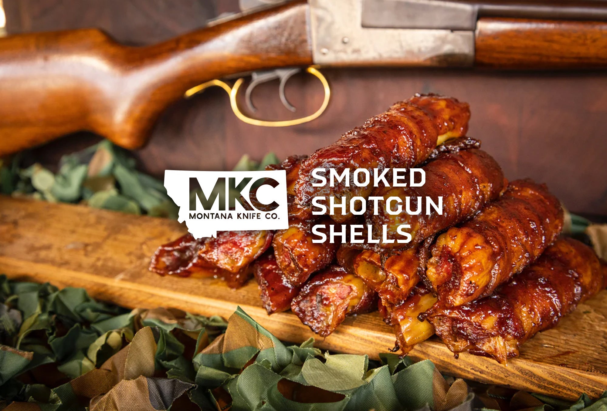 Glazed smoked shotgun shell appetizers with bacon wrap on wooden board near hunting rifle.